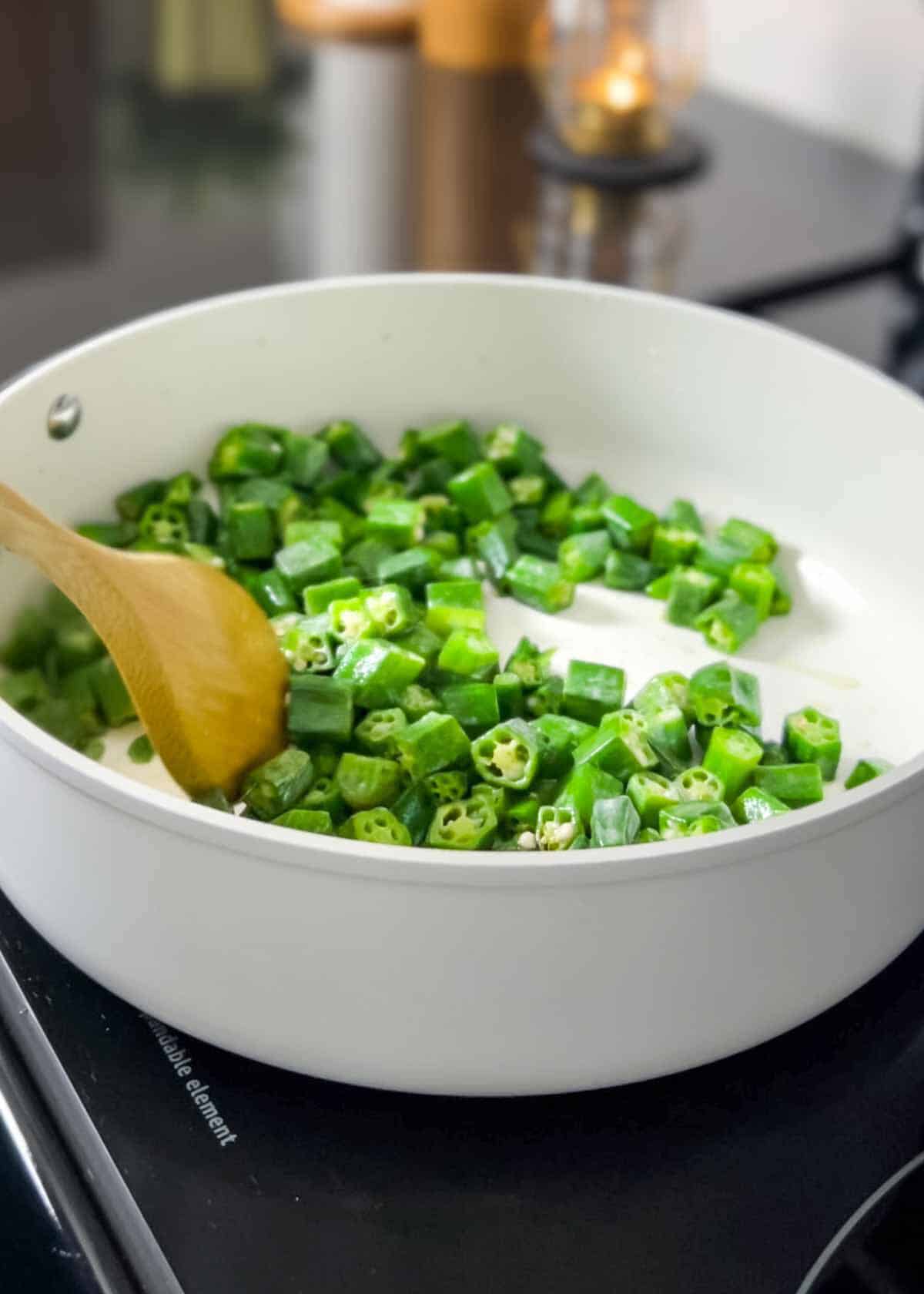 sautéing bhindi/okra in a pan