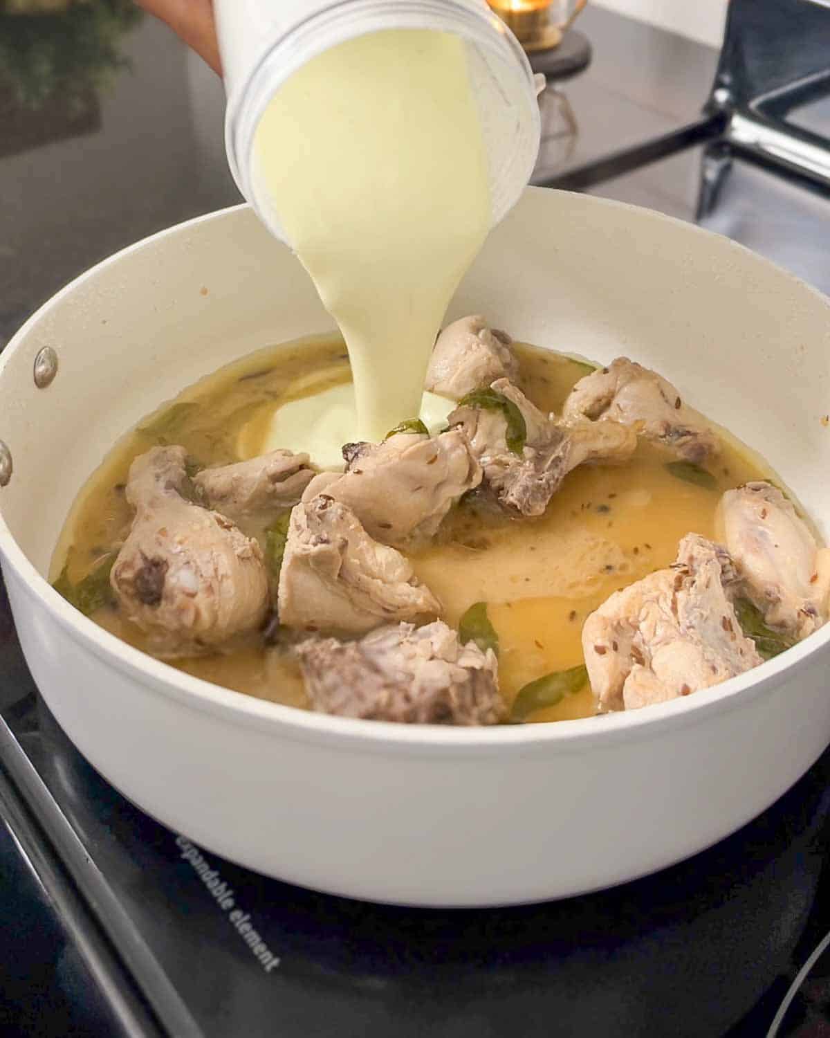 adding potato based spiced puree to the pot