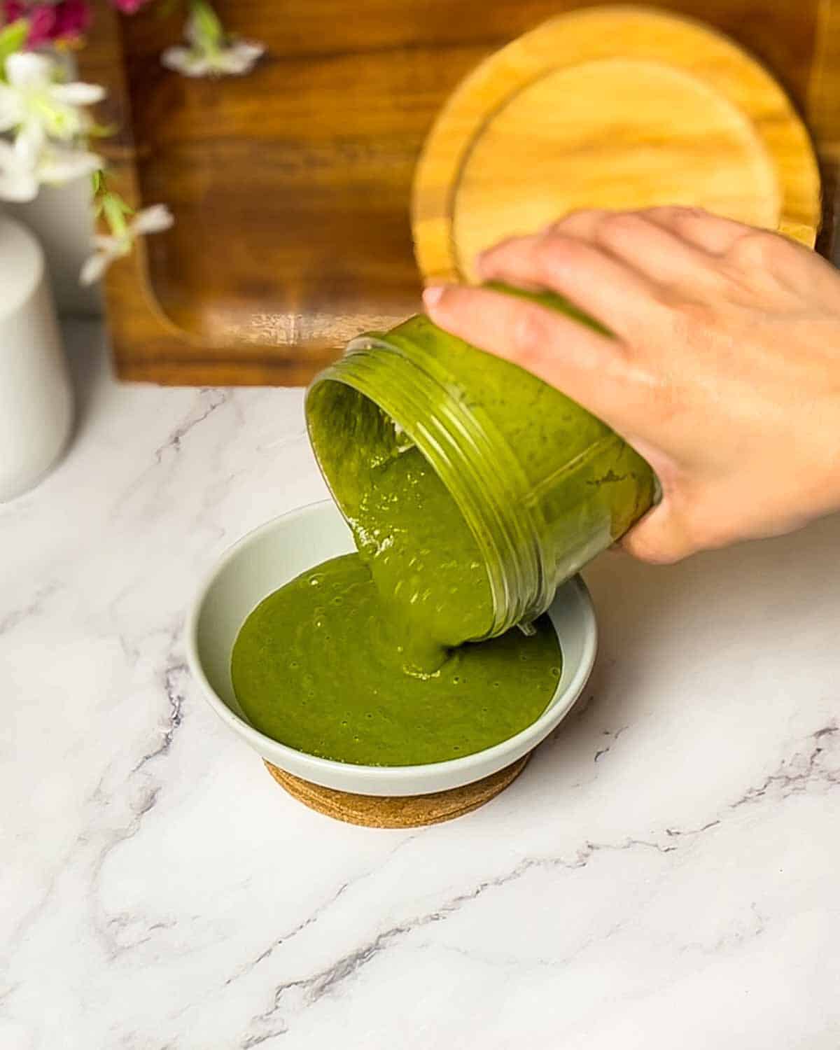 transferring chutney into a bowl