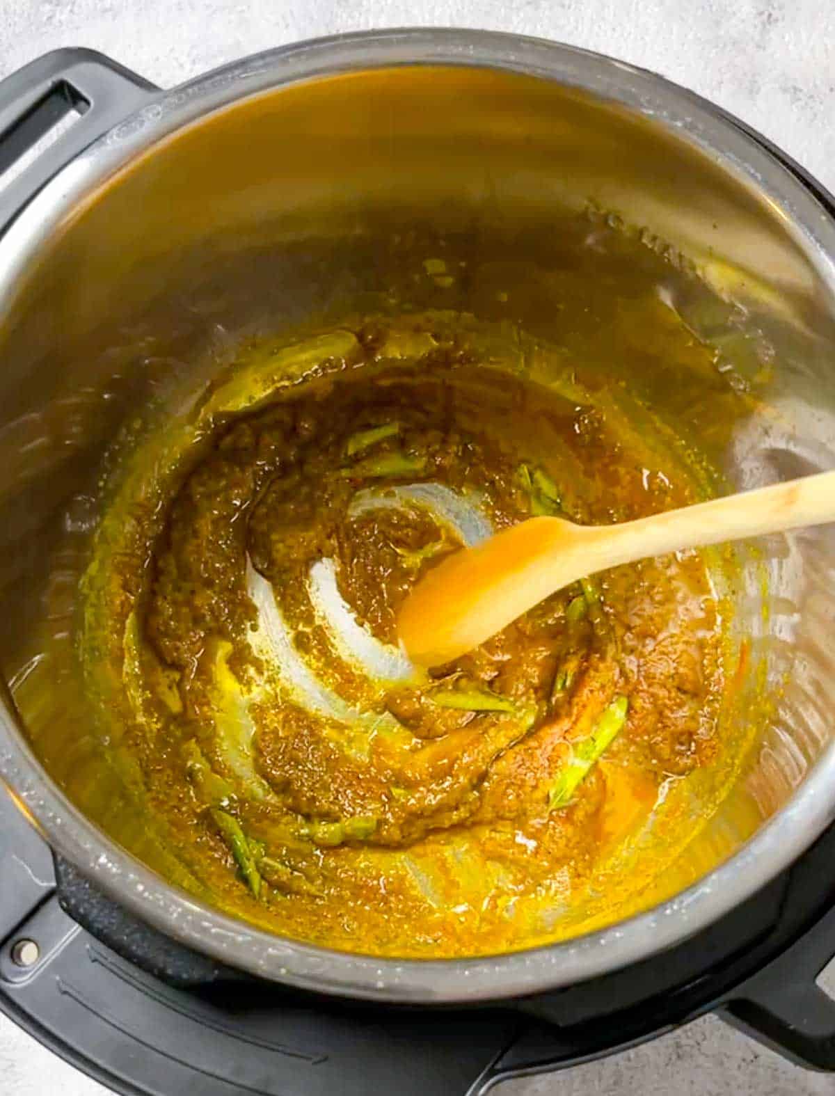 sautéing aromatics with spices and tomato paste