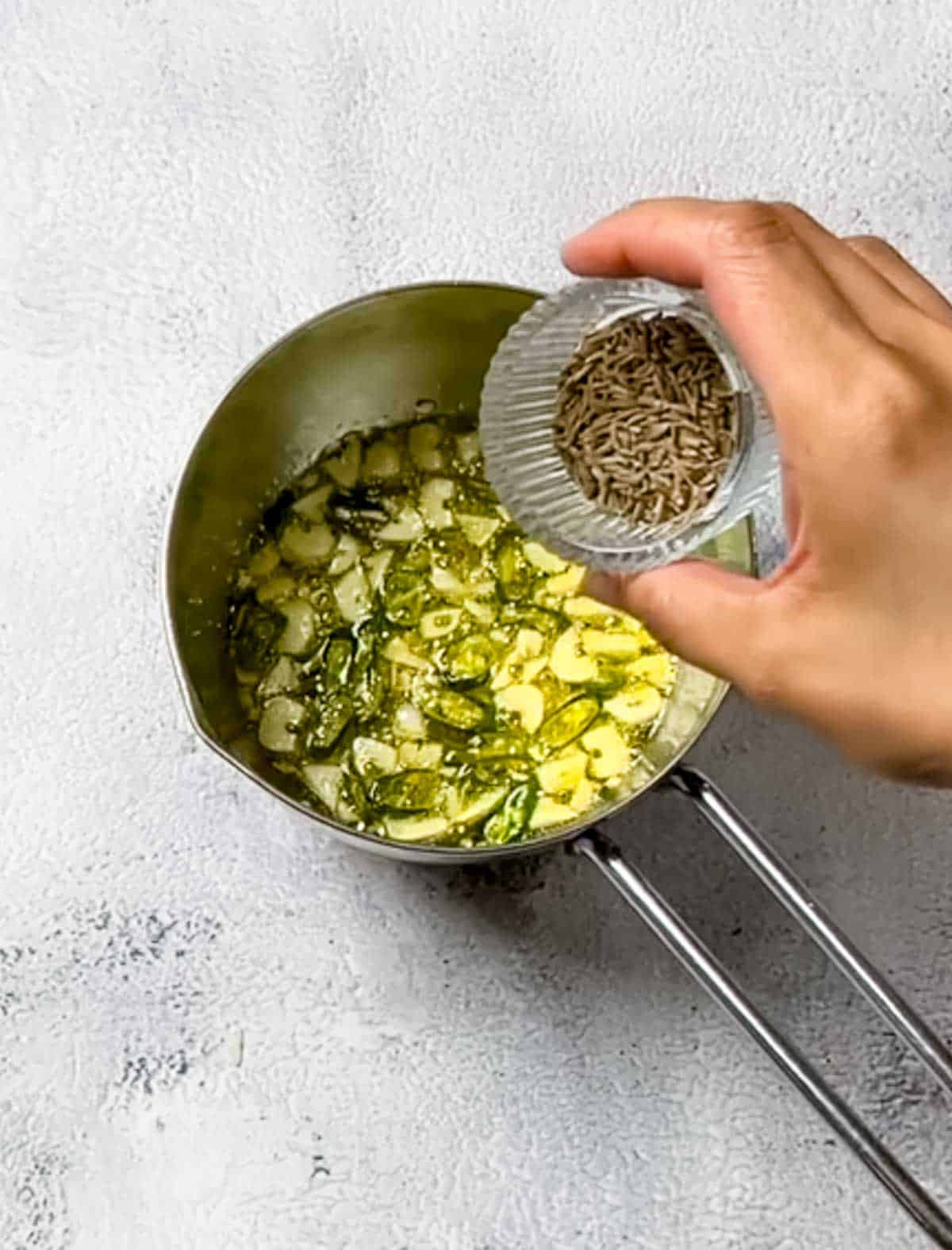 making tarka for dal