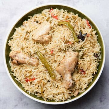 Chicken pulao in a deep plate on a table