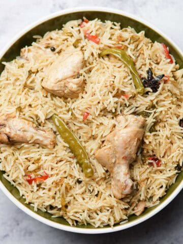 Chicken pulao in a deep plate on a table