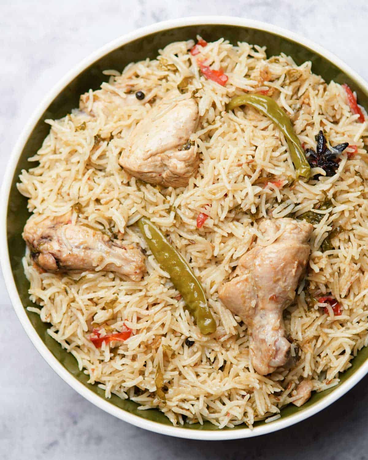 a plate containing chicken pulao