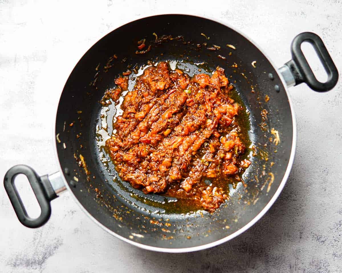 glossy tomato sauce base in a pan