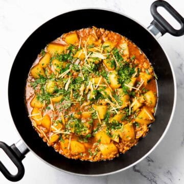 a wok containing chicken aloo keema