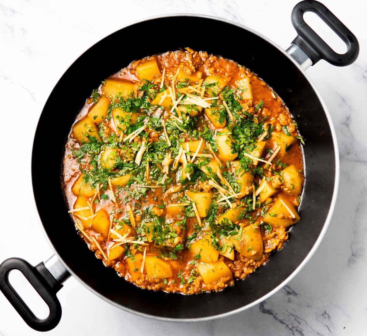 chicken aloo qeema in a wok