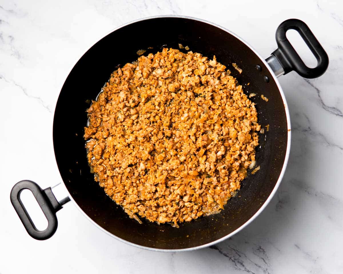 chicken keema mince cooking with spices in a wok