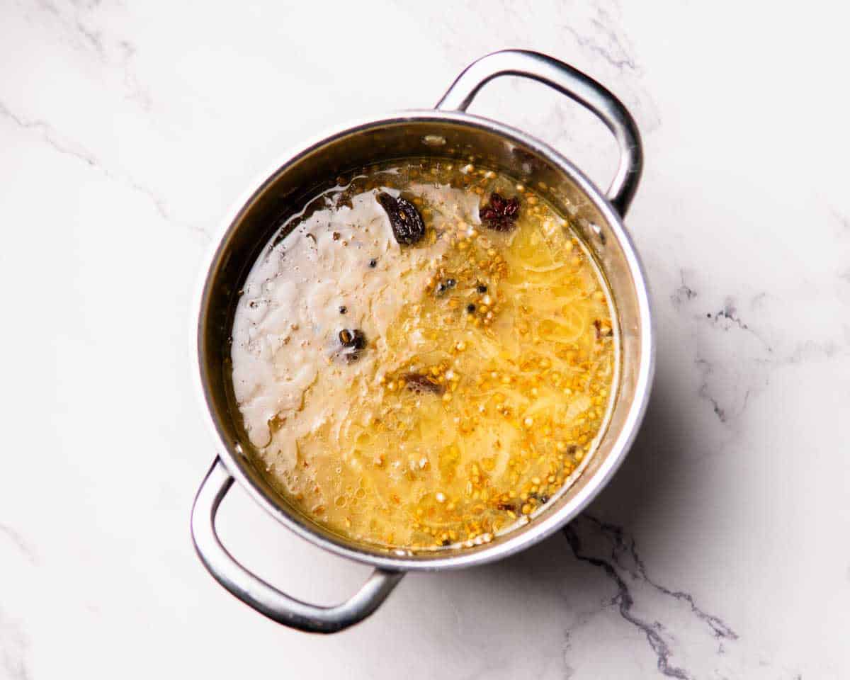 masala broth/yakhni boiling in a saucepan