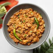 achari keema served on a gray plate