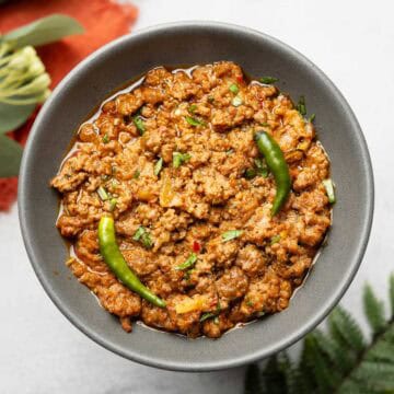 achari keema served on a gray plate