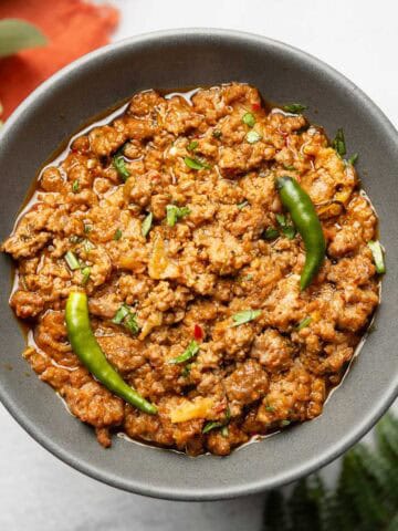 achari keema served on a gray plate