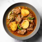 aloo gosht served on a plate