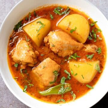chicken aloo salan served in a deep bowl