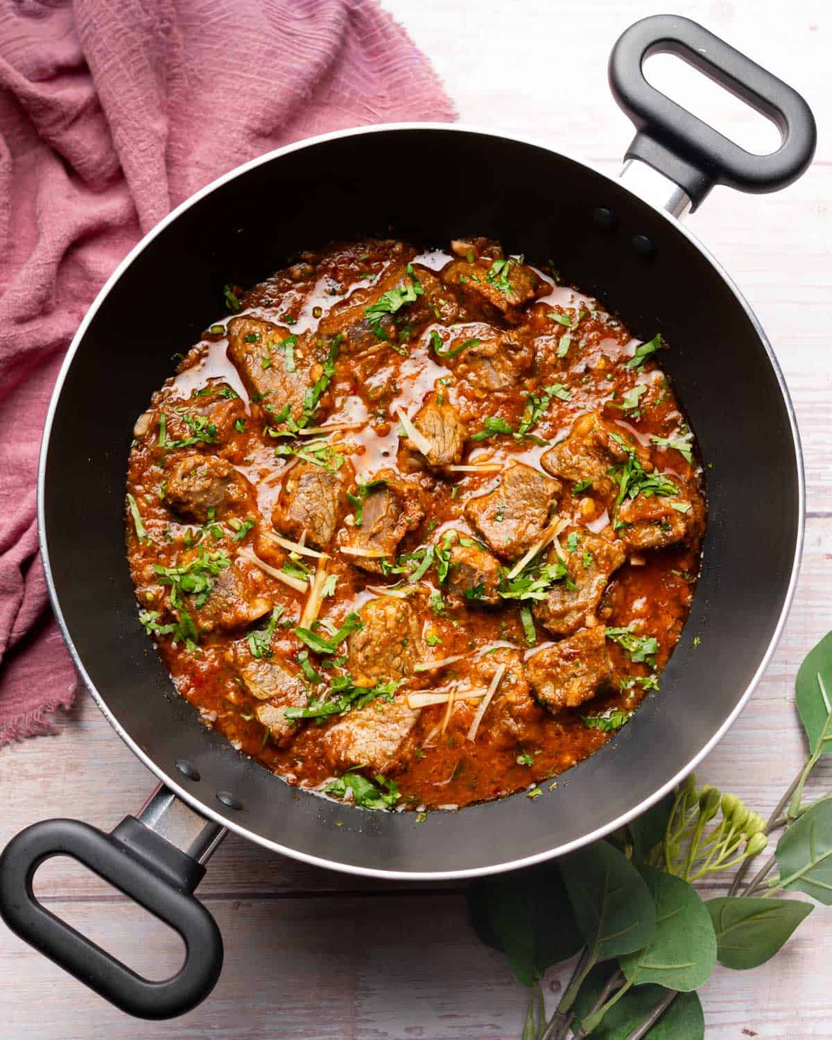 beef karahi in a black wok