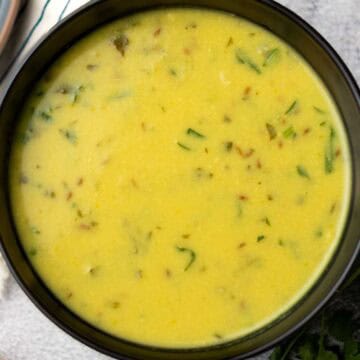 urad dal served in a black bowl