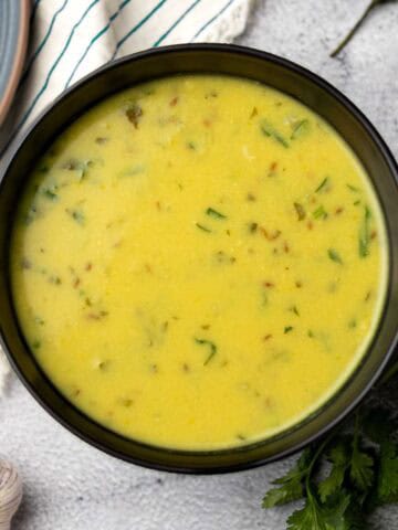 urad dal served in a black bowl