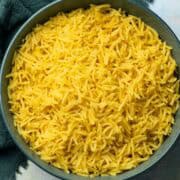 yellow rice in a shallow bowl
