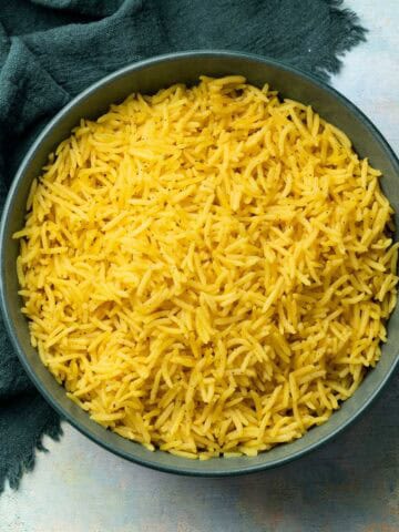 yellow rice in a shallow bowl