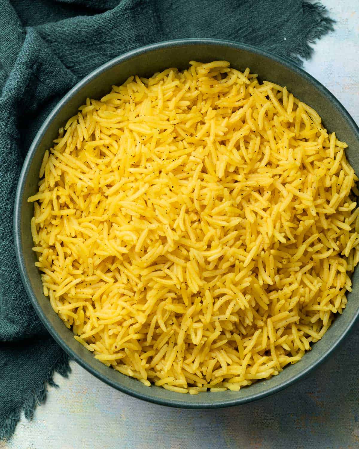 yellow rice in a shallow bowl